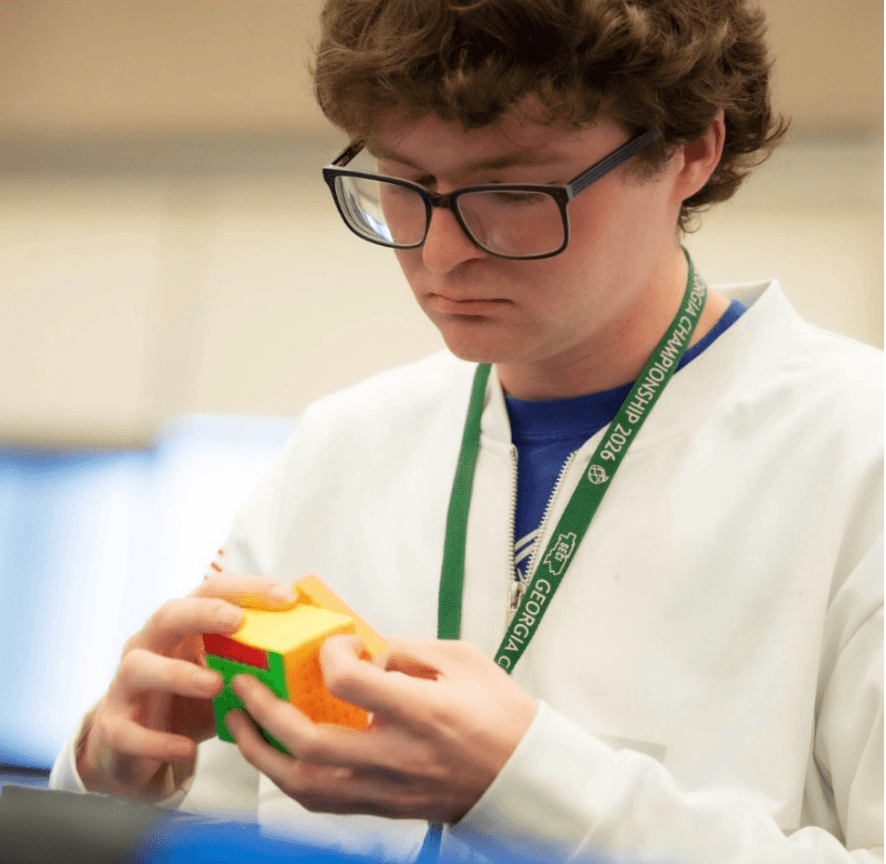 Sean Hartman holding a cube