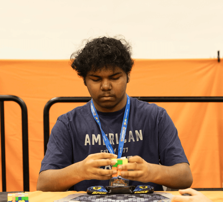 Vishwa Sankar holding a cube