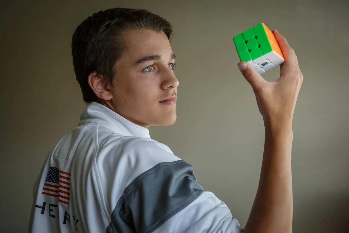 Tommy Cherry holding a cube